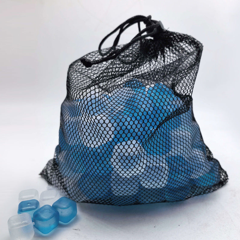 A black mesh drawstring bag filled with blue and white round gel or ice-like pieces, photographed on a plain light background with a few loose blue and white pieces in front.